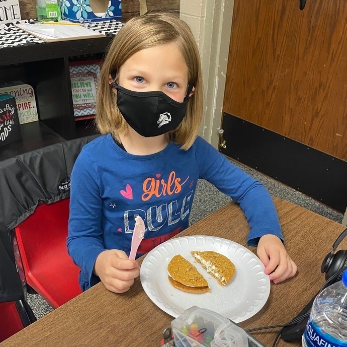 1st grade students in Mrs. Halbrook's class worked on halves, fourths, quarters with oatmeal cookies.