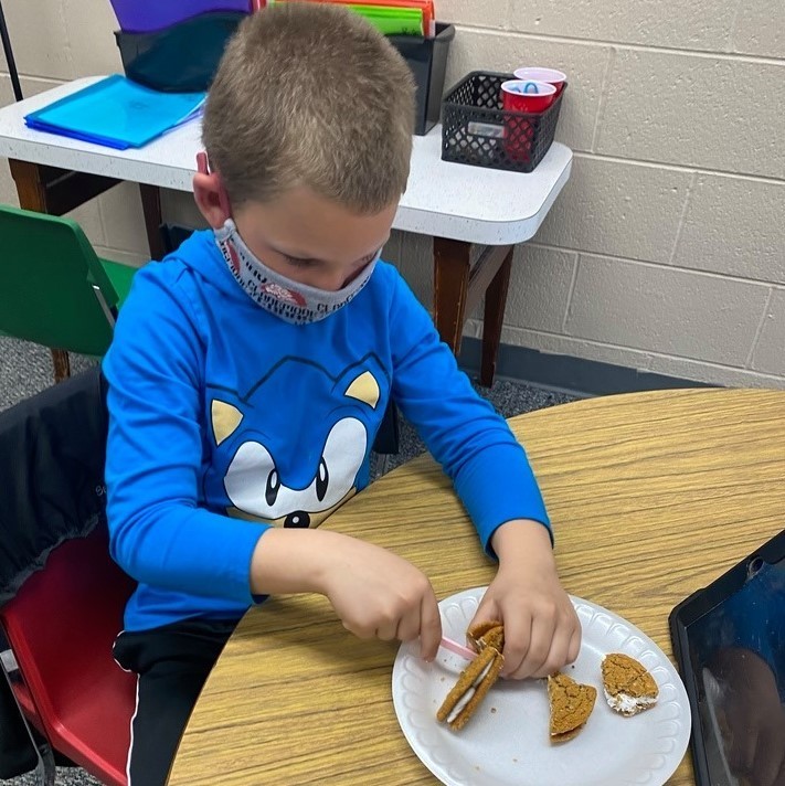 1st grade students in Mrs. Halbrook's class worked on halves, fourths, quarters with oatmeal cookies.