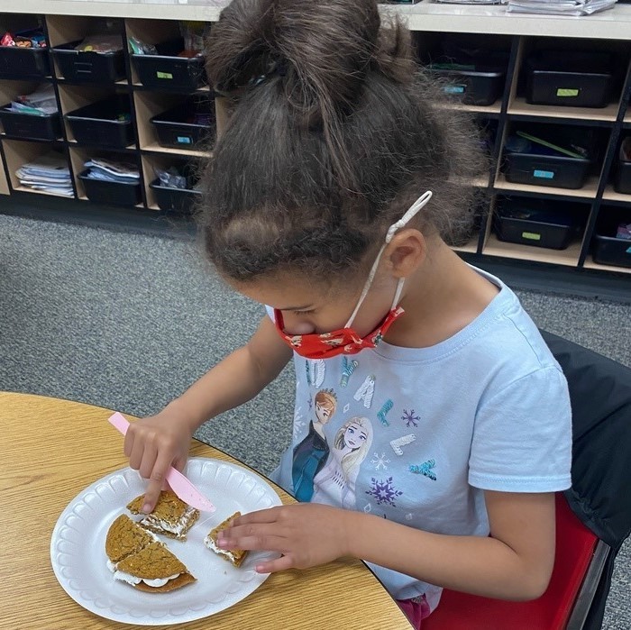 1st grade students in Mrs. Halbrook's class worked on halves, fourths, quarters with oatmeal cookies.