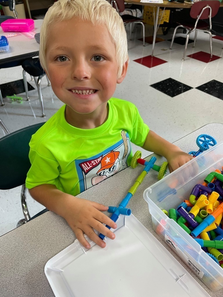 boy playing with manipulatives