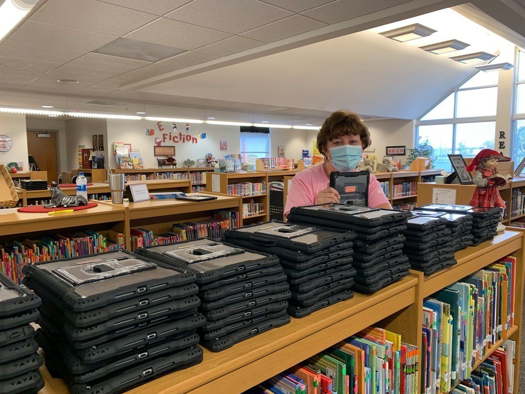 Mrs. Hall working on devices