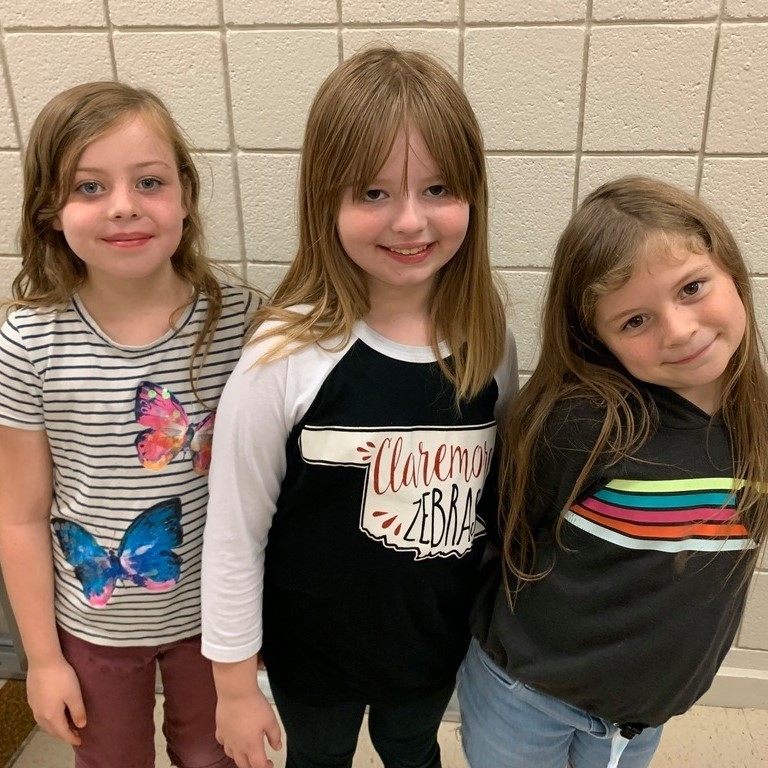 2nd grade girls wait to be dismissed from lunch - an excellent example of how to follow procedure and model how to be patient and wait.