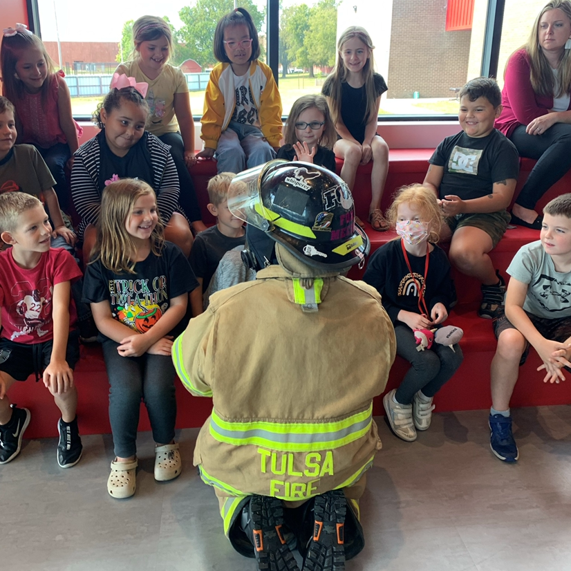 firewoman talking to students