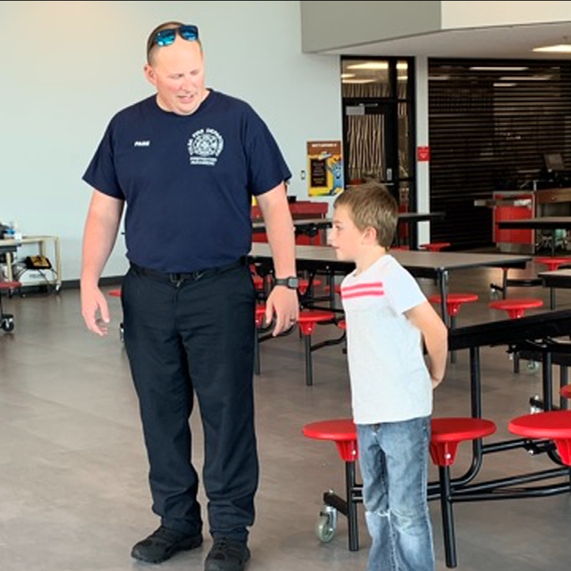 fireman taking to student
