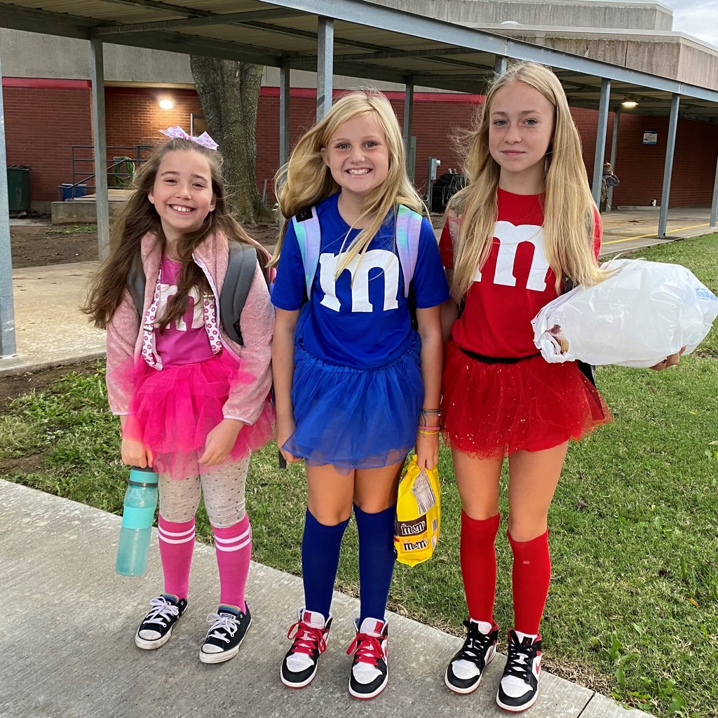three girls dress as M&Ms
