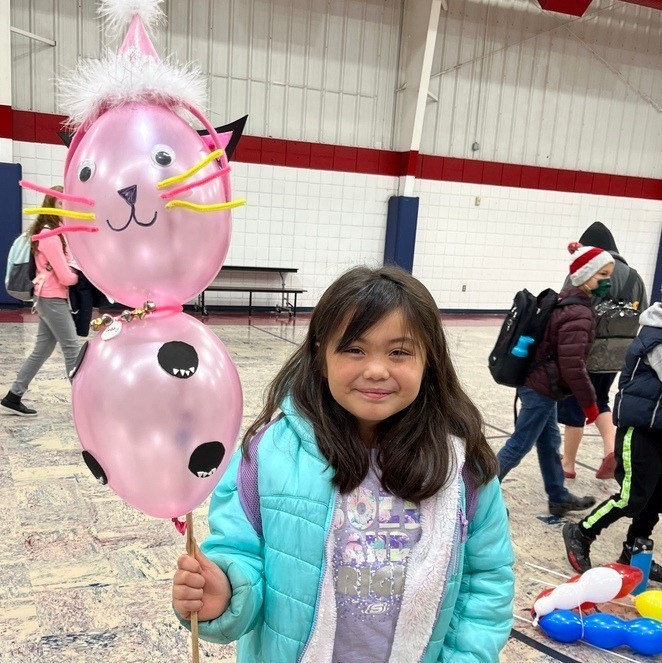 students with cat balloon character