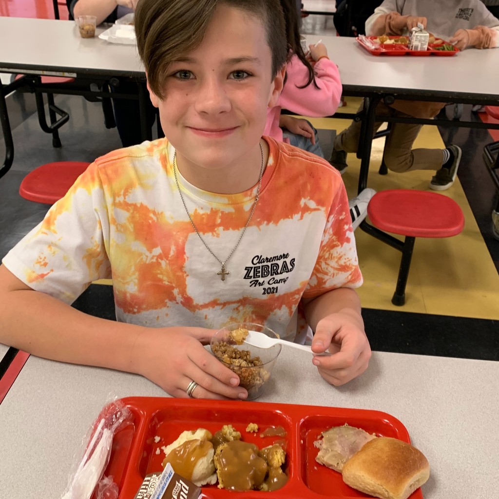 Student eating Thanksgiving meal