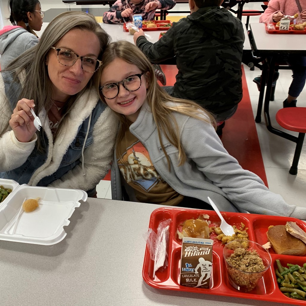 Student & parent eating Thanksgiving meal