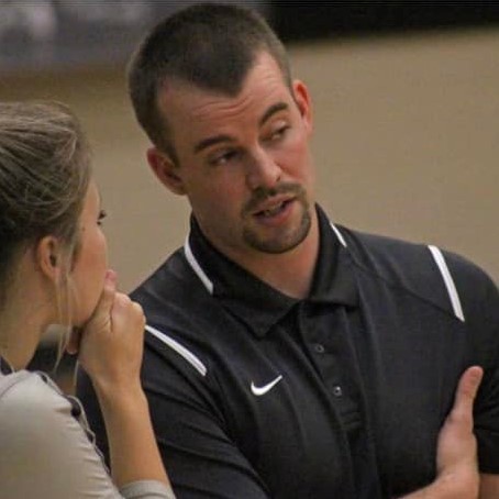 Coach Jackson talking to 1 palyer