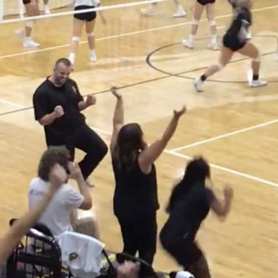 coach Jackson celebrating a win on the court