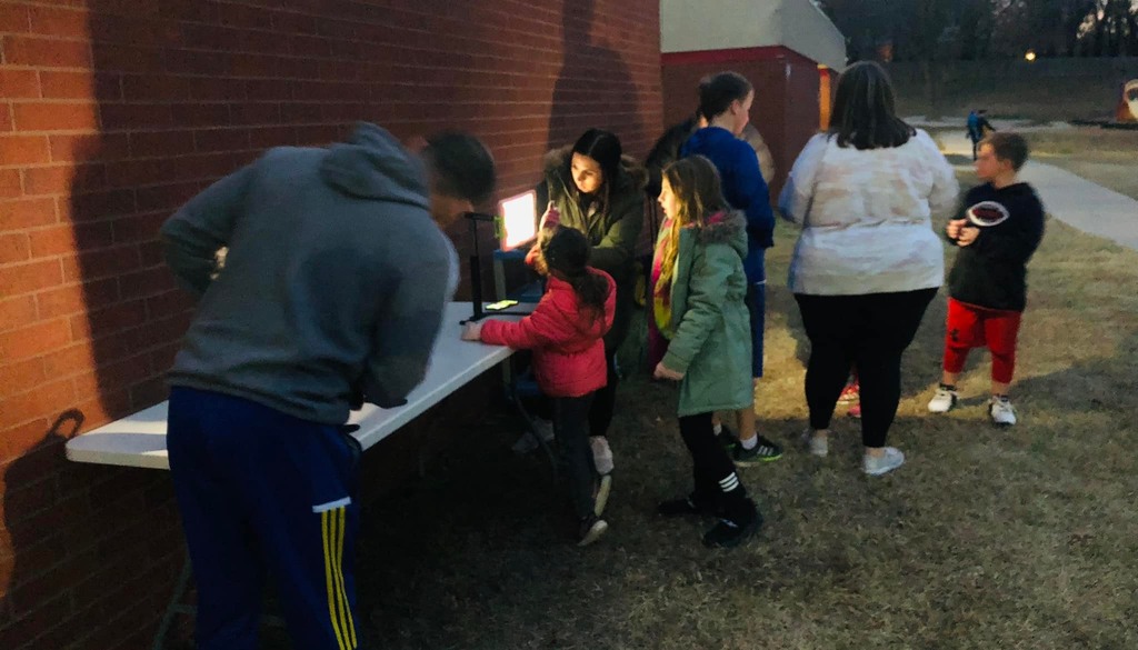 student checking in for the Turkey Trot canned food run