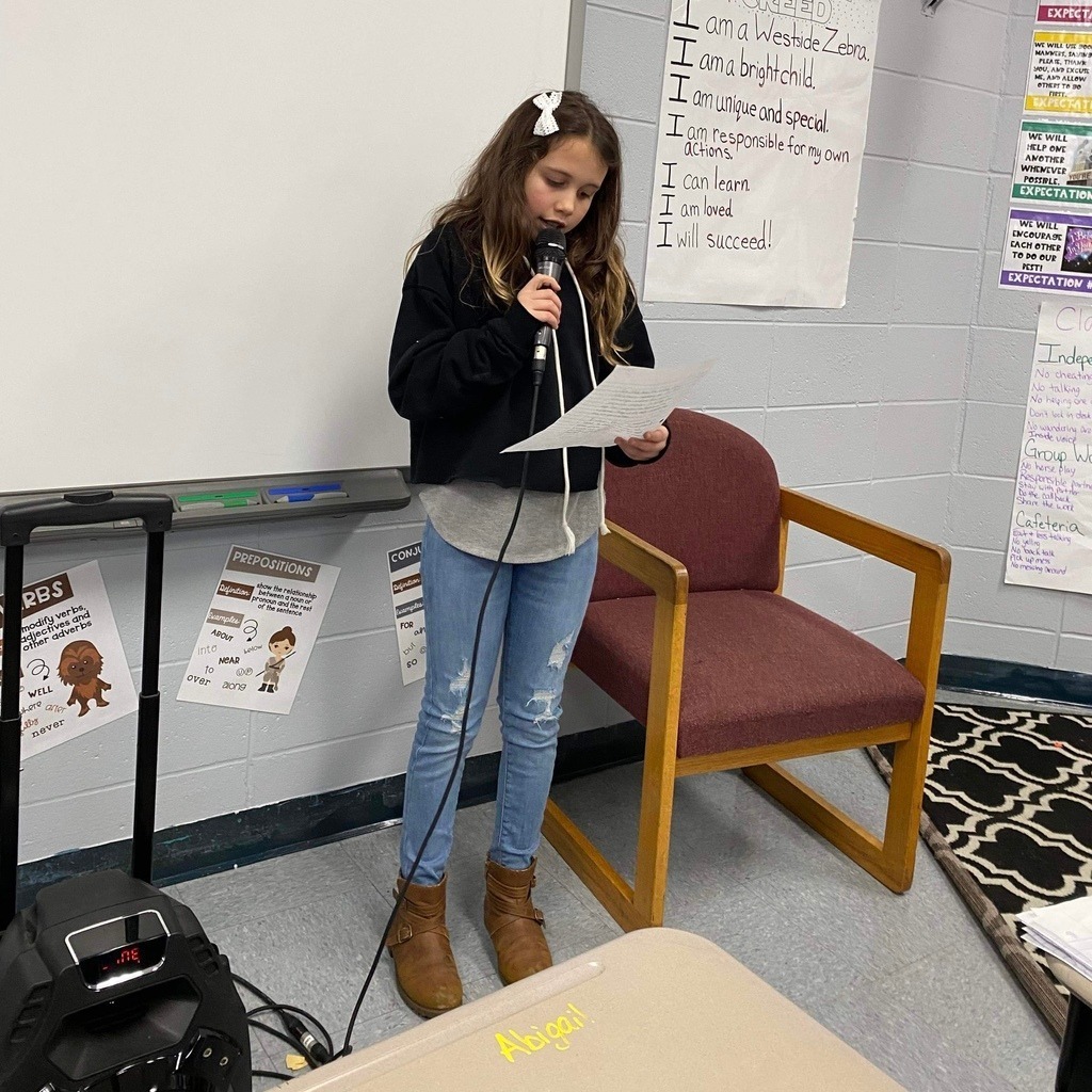 student speaking with a microphone