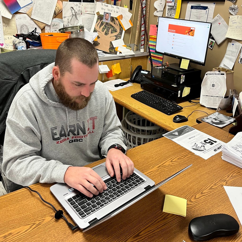 teacher teaching from a computer