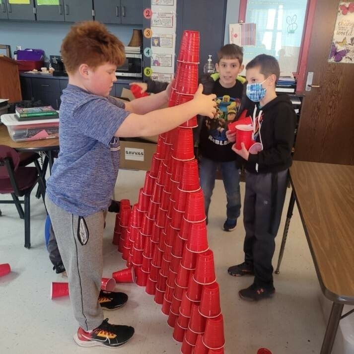 students building a  tower of solo cups