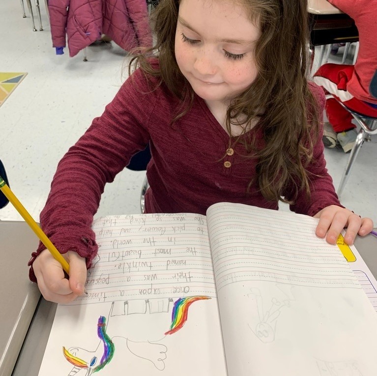 student writing in journal 