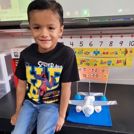 kid with airplane