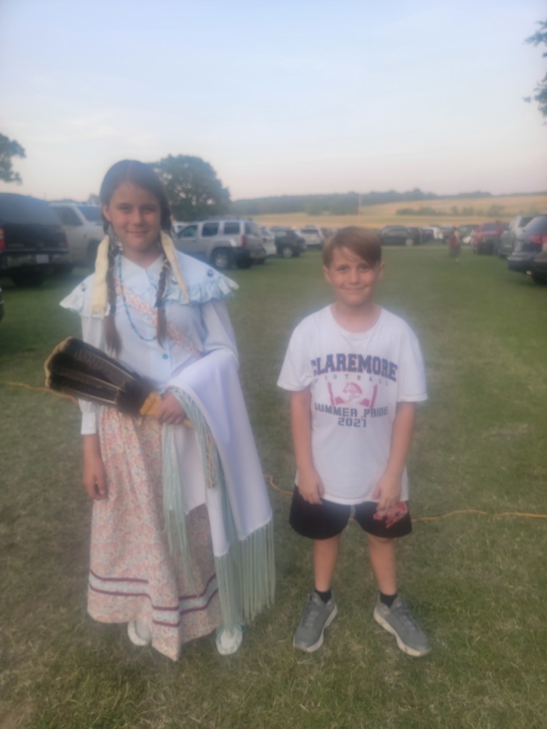 students in authentic native american clothes