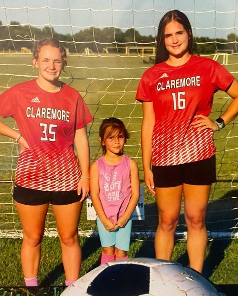 girl with 2 CHS soccer players