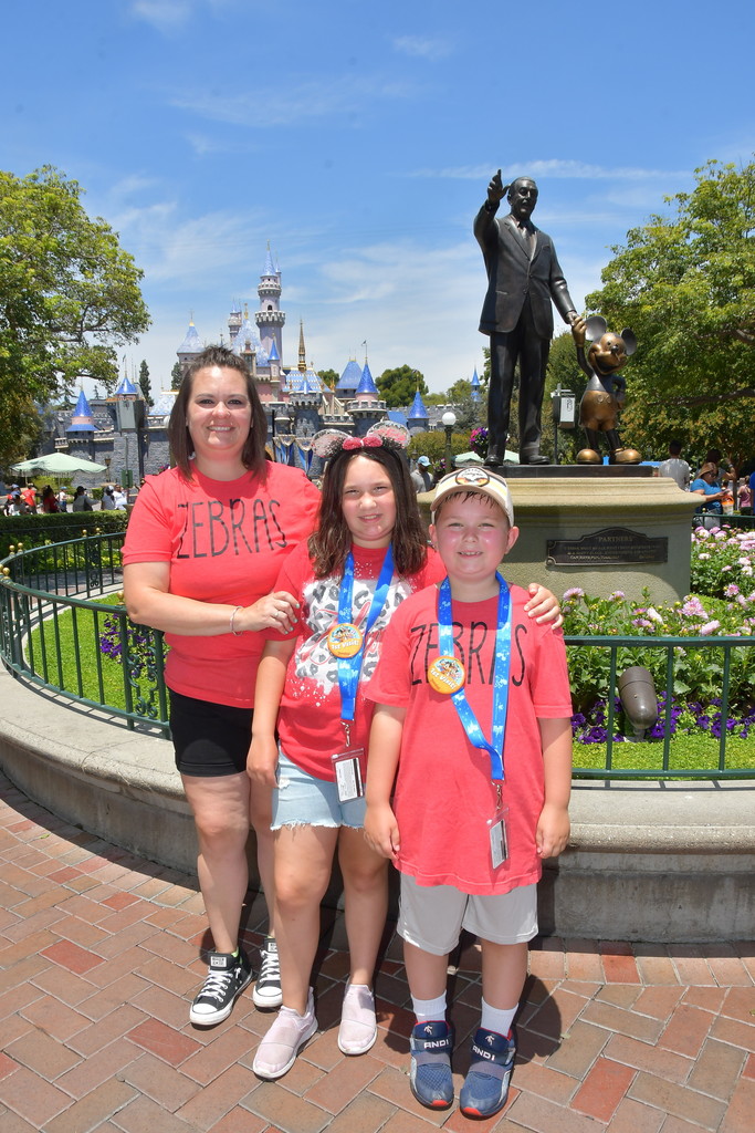 family in front of statue