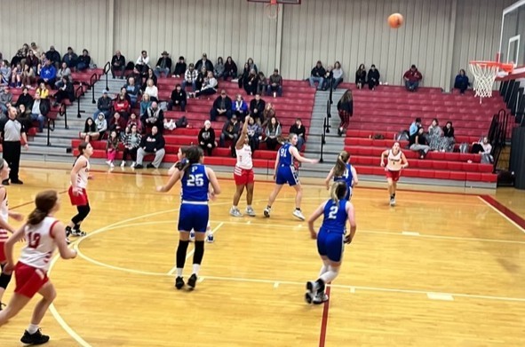 junior high students playing basketball