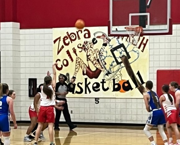 junior high students playing basketball