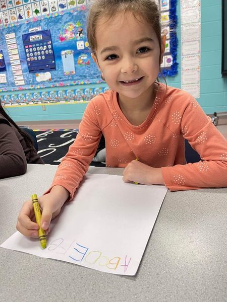 student working on a whiteboard