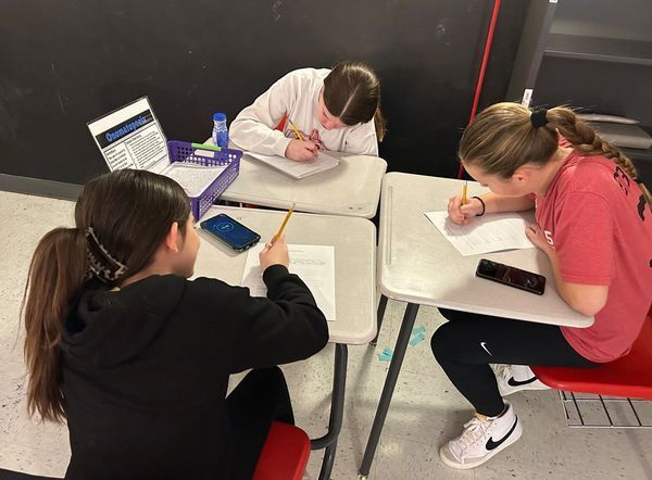 students working on writing assignment