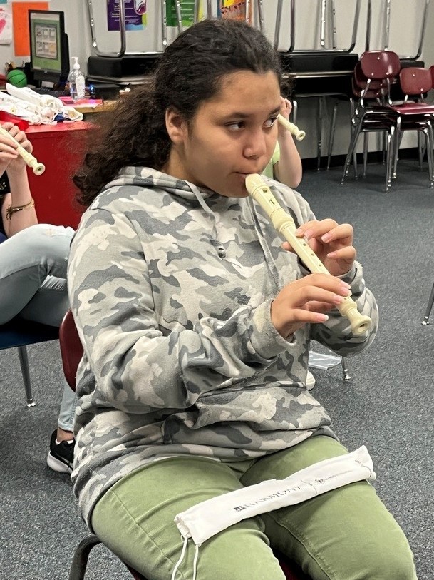 student playing the recorder