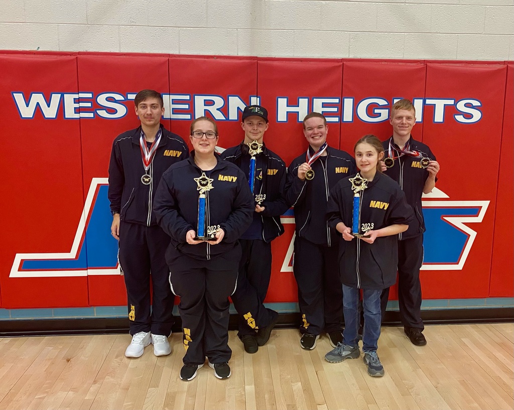 NJROTC corps of cadets holding first place trophies