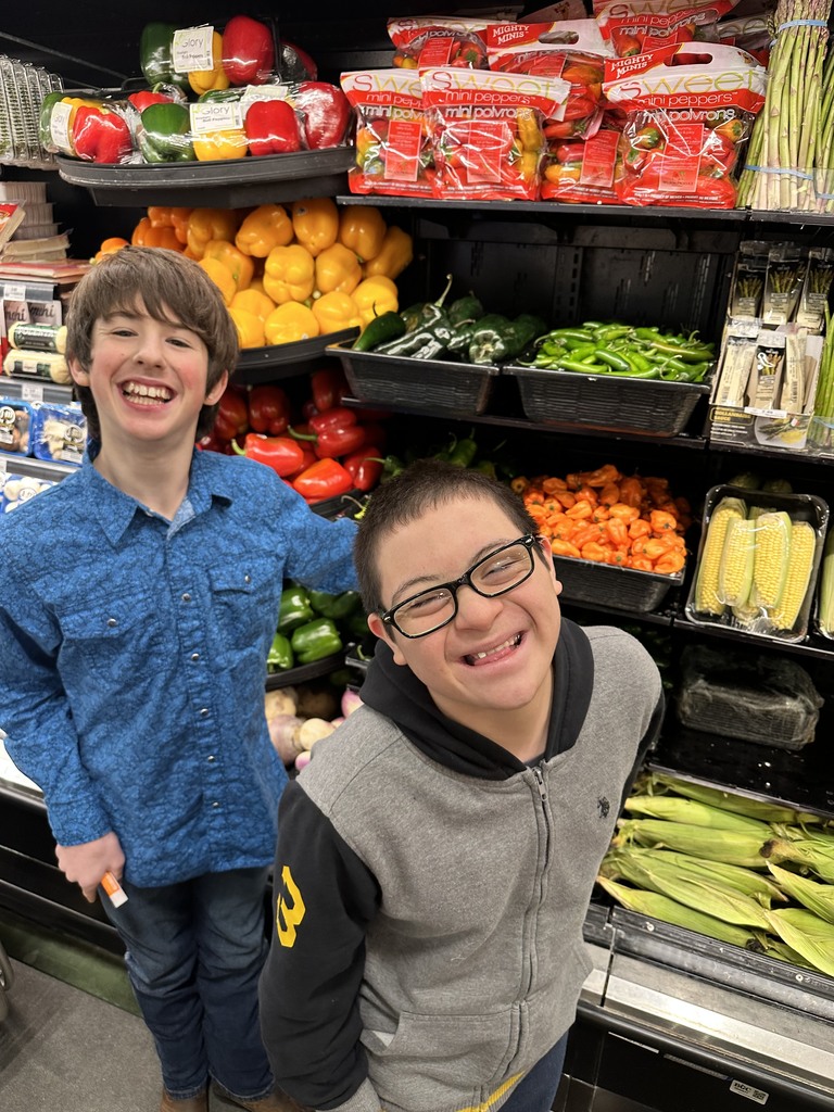 students in the isle at the grocery store