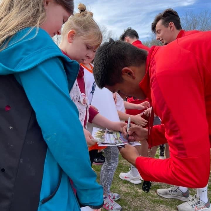 Soccer player signing autograph