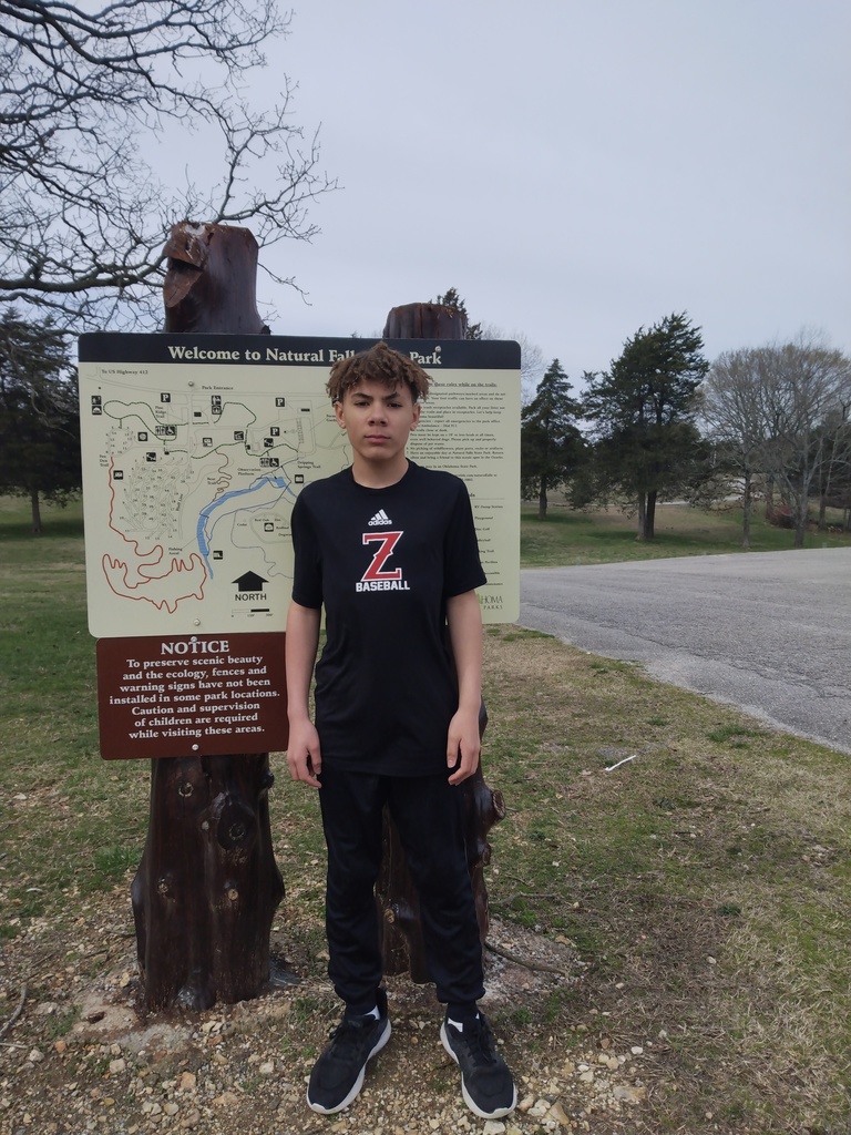 student in front of park map