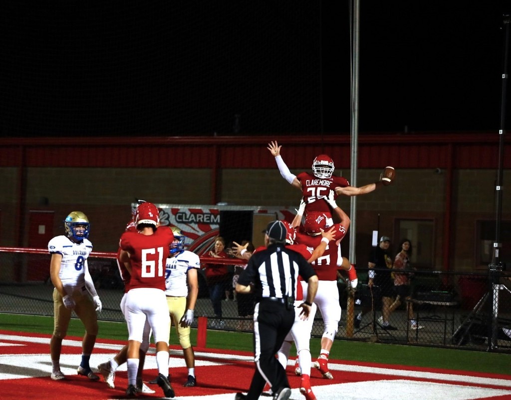Claremore Football Team celebrating a touchdown