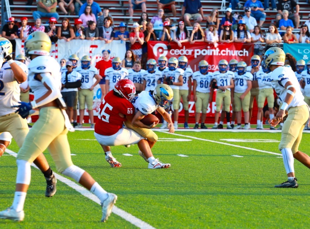 Claremore Football player making a tackle