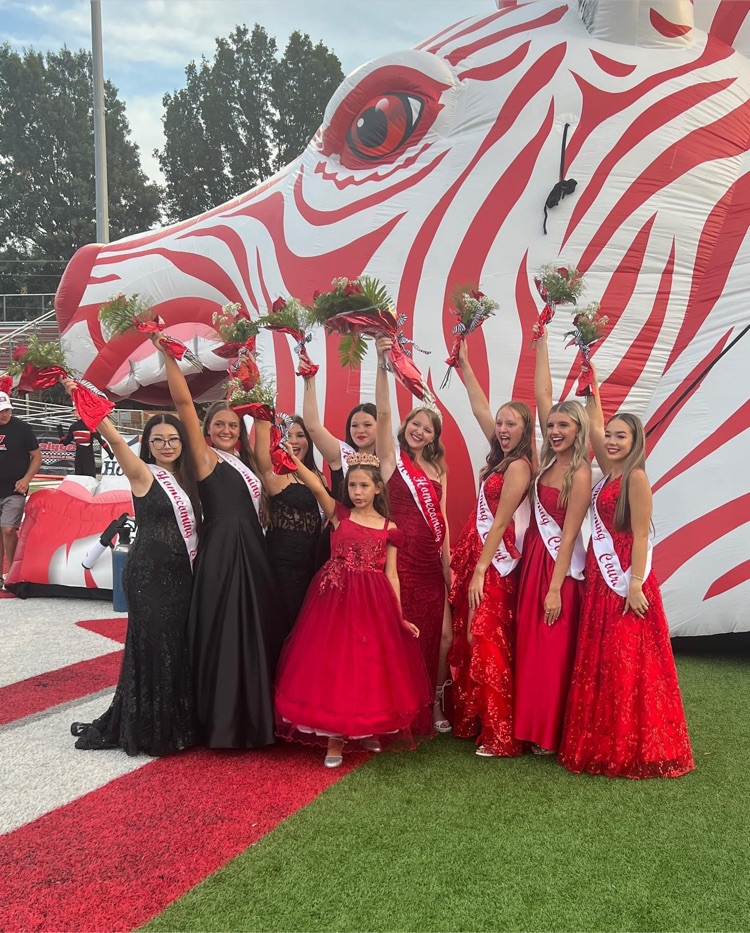 claremore girls royalty in front of the zebra
