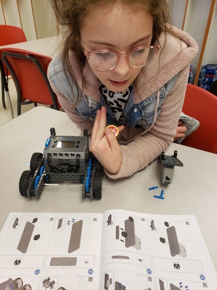 Miss Hall and the STEM club build their robots