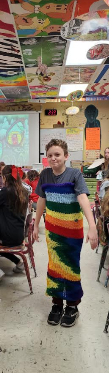 One of Mrs. Miller's art students created a multi-purpose scarf knitted on a loom. 