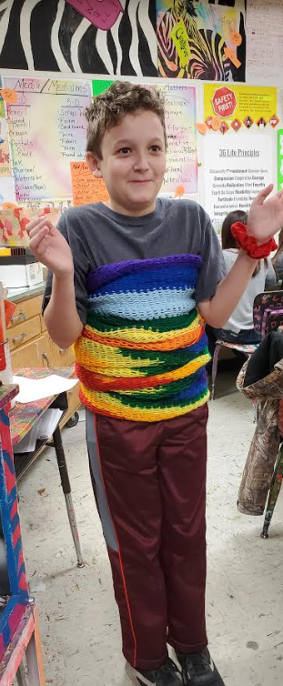 One of Mrs. Miller's art students created a multi-purpose scarf knitted on a loom. 