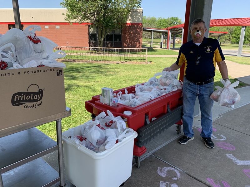 Commander passing out Grab & Go meals during the shutdown