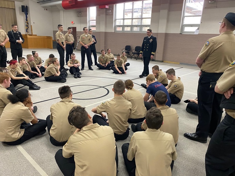 Cadets gather around for discussion from inspector