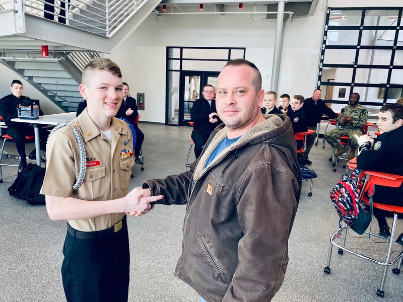 Cadet Commanding Officer Hudson's father pinned on his Silver Wings. 