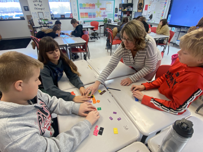 ritter working with students at tables 