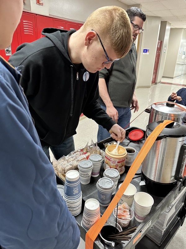 student making drinks