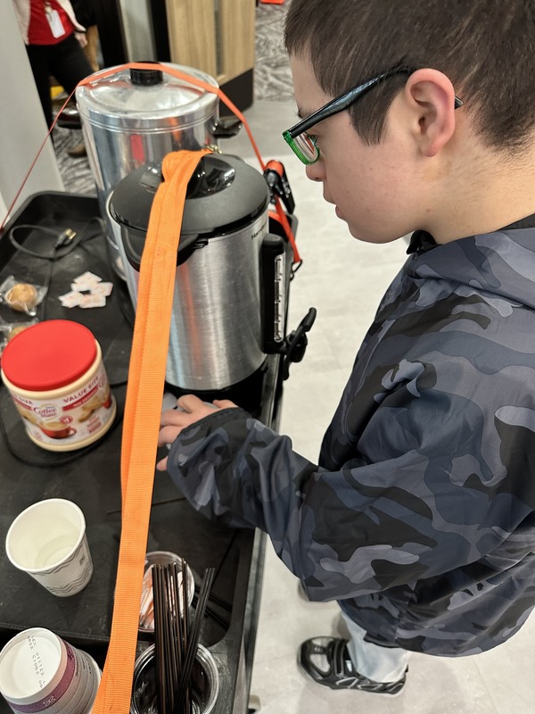 student making drinks