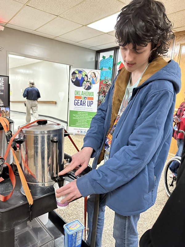 student making drinks