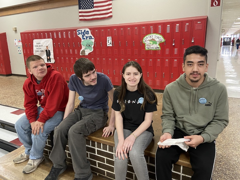 students sitting on bench