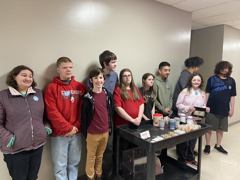 students standing with cart